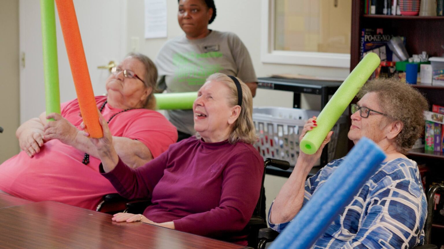 People doing an activity at a skilling nursing care facility